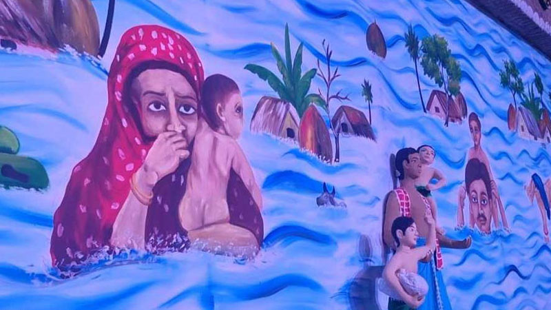 মণ্ডপের দেয়ালে দেয়ালে মানবতার চিত্র মণ্ডপের দেয়ালে দেয়ালে মানবতার চিত্র