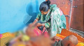 অশ্রু লুকিয়ে ছেলের চোখ মুছছেন মা